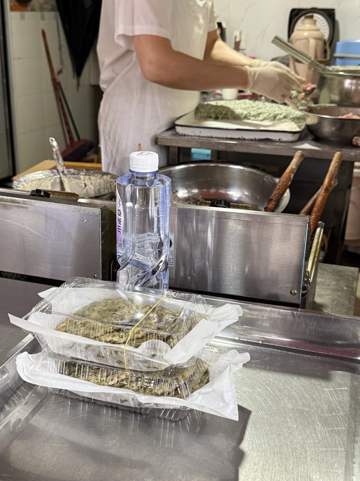 Steamed dumplings and pots at a street-food counter