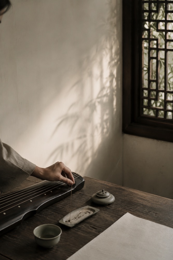 Guqin, incense and tea in a quiet studio
