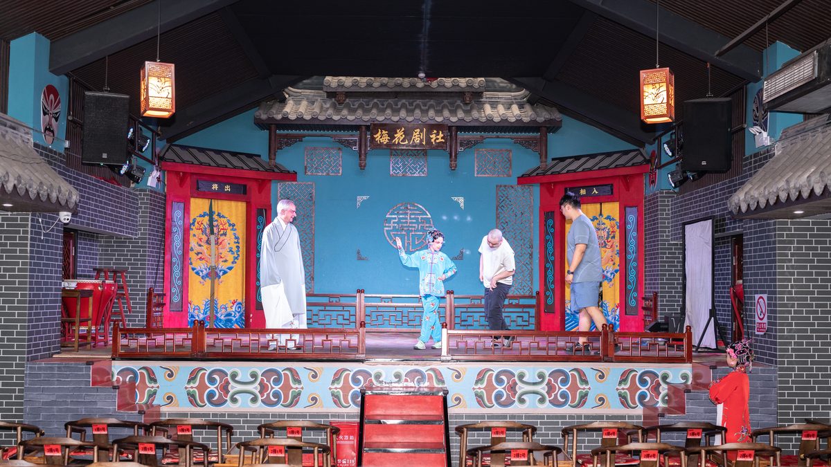 A wide view of the opera stage during a performance
