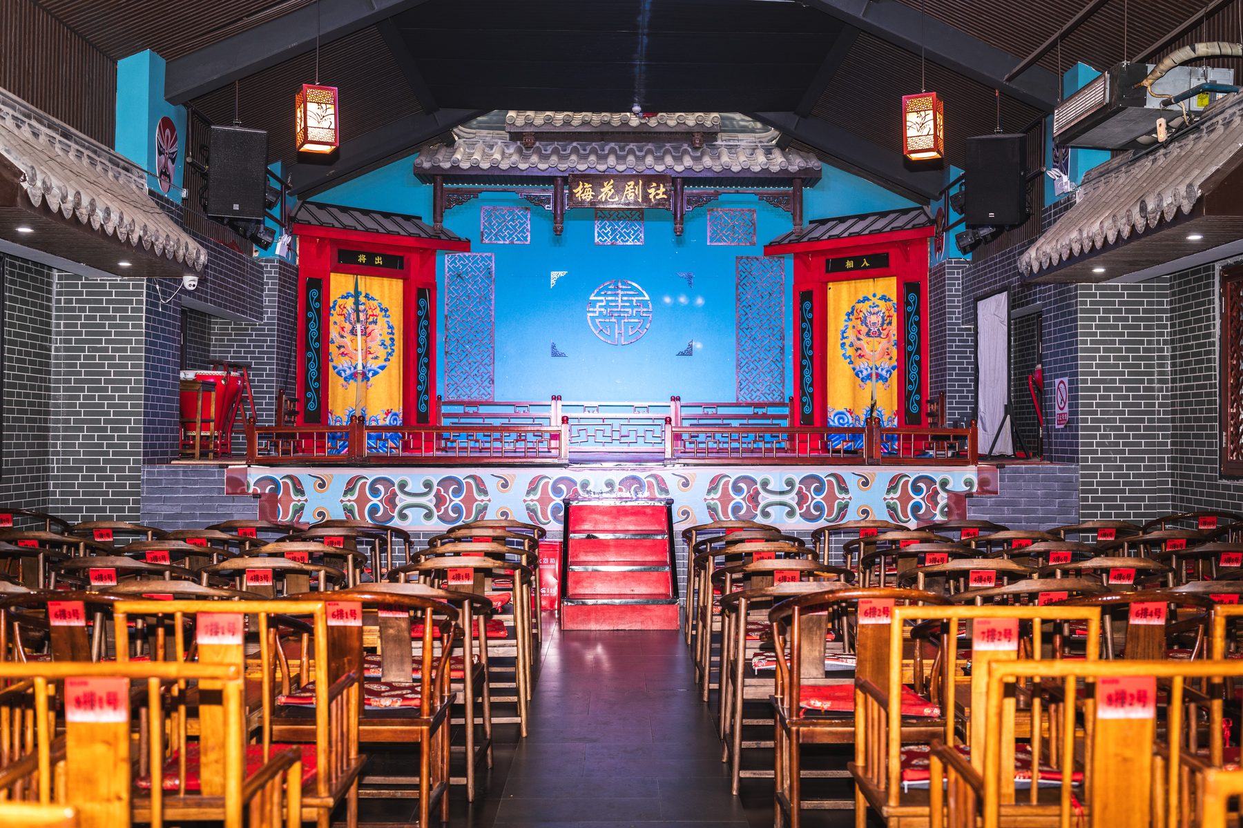 The empty auditorium and painted stage of a Chengdu opera house